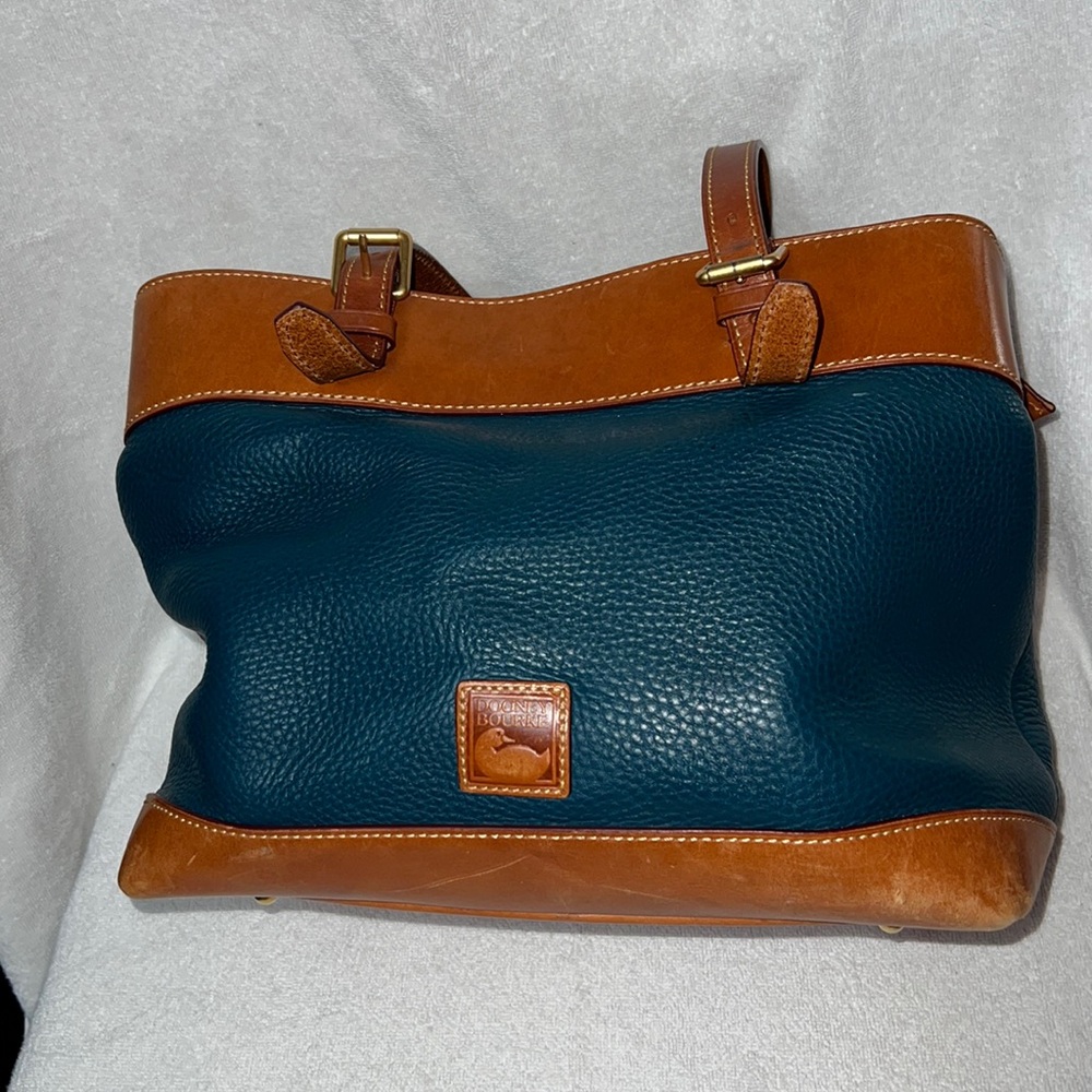 Gently used large Dooney and Bourke leather handbag in teal and tan.
